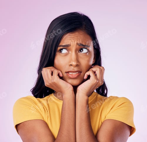 Preview: Scared, worry and face of Indian woman on pink background with fear, nervous and confused expressio