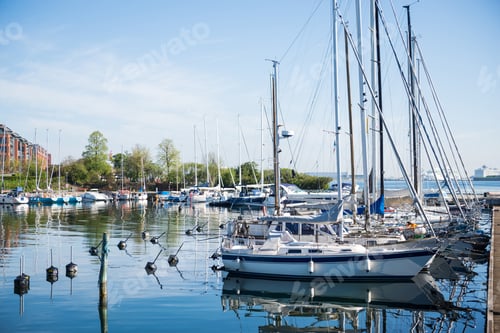 Preview: COPENHAGEN, DENMARK - MAY 6, 2018: yachts and boats on calm water in harbour of copenhagen, denmark