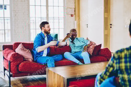 Preview: Multicultural hipster guys with takeaway coffee to go spending leisure togetherness