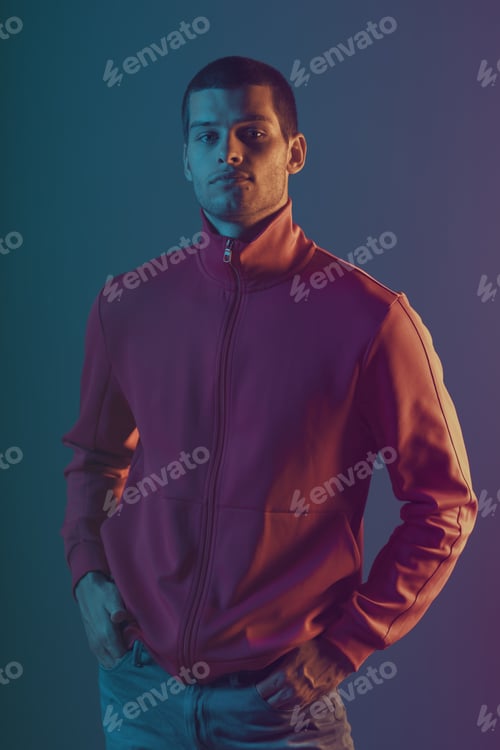 Preview: Studio close-up portrait of attractive male model. Color flash studio light
