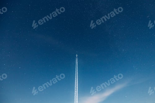 Preview: Contrail In Blue Sky. Aircraft Plane In Starry Night Sky Background. Plane Flying Up To Space With