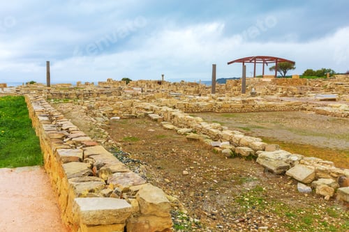 Preview: Exploring ancient ruins at a historical site in a coastal location during cloudy weather