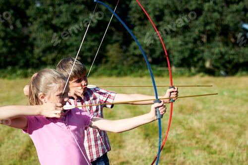Preview: Girl and teenage brother practicing archery