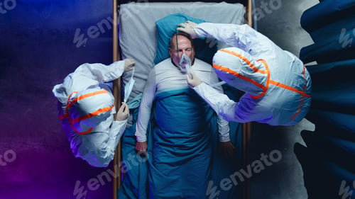 Preview: Top view of doctors and covid-19 patient with oxygen mask in bed in hospital, coronavirus concept.