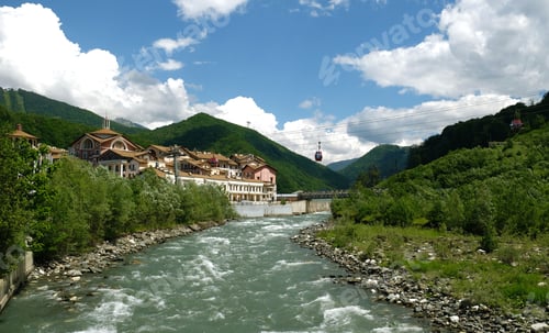 Preview: Mountain landscape. View of the river and mountains in the clouds.