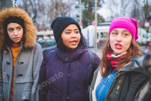 Preview: three young women interacting and walking outdoor