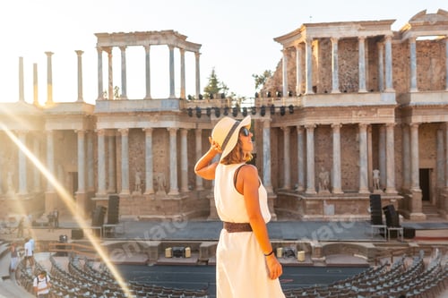 Preview: Merida Roman Ruins, a young tourist visiting the Roman Theater at sunset. Extremadura, Spain