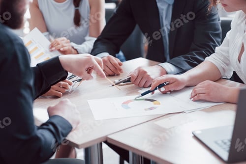 Preview: A group of business partners discusses the ideas during an office meeting