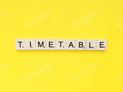 Preview: Timetable scrabble letters word on a yellow background