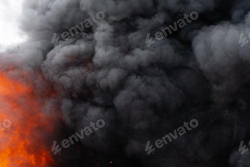 Preview: Flames of Red Fire and Motion Blur Clouds of Black Smoke Covered Sky