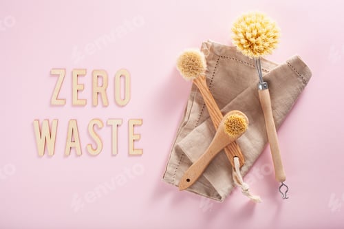 Preview: zero waste eco friendly cleaning concept. wooden brushes on pink background