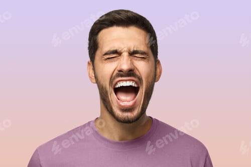 Preview: Closeup portrait of screaming with closed eyes crazy young man isolated on purple