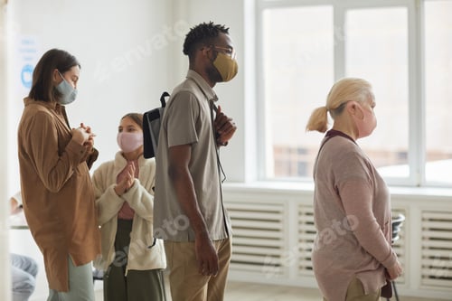 Preview: Diverse Group of People Waiting in Line at Clinic