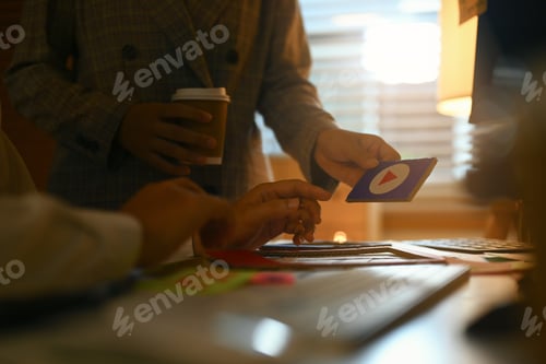 Preview: Creative designers planning application process development for web mobile phone at office