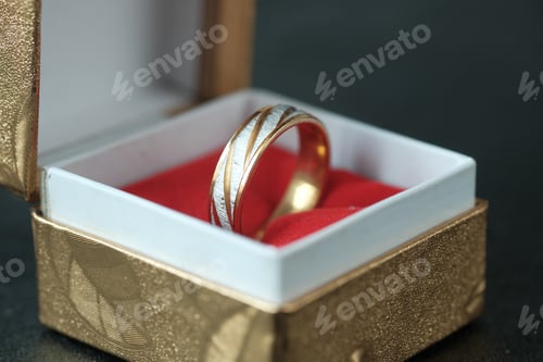 Preview: wedding ring in a box on red background ,