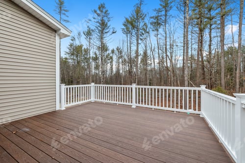 Preview: Decking boards of a porch with white railings in a suburb house with shutters