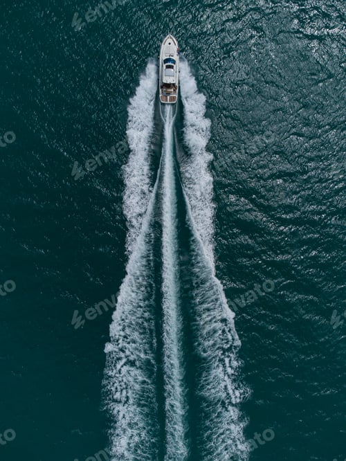 Preview: Aerial top down view of speed motor boat on open sea at summer day