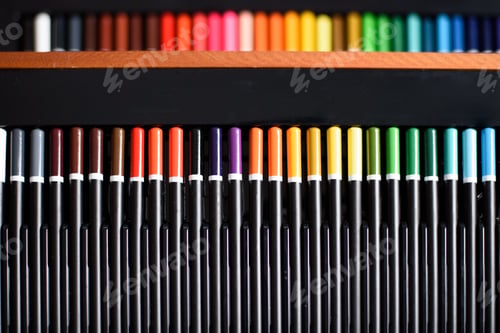 Preview: Set of colored pencils arranged in gradient with artistic copy space.