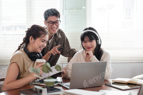 Preview: A cheerful and intelligent young Asian man is standing and sharing his thoughts in a meeting with
