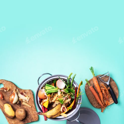 Preview: Top view of kitchen food waste collected in recycling compost pot. Peeled vegetables on chopping