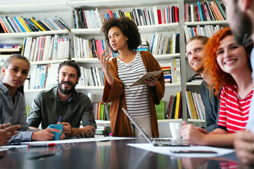 Preview: Young businesswoman leading a discussion during a meeting with her colleagues.