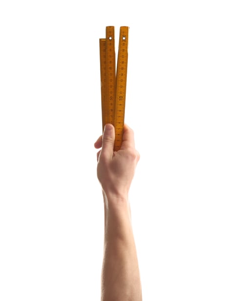 Preview: Man holding ruler on white background. Construction tools