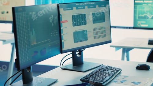 Preview: Empty boardroom meeting space with computer at workstations