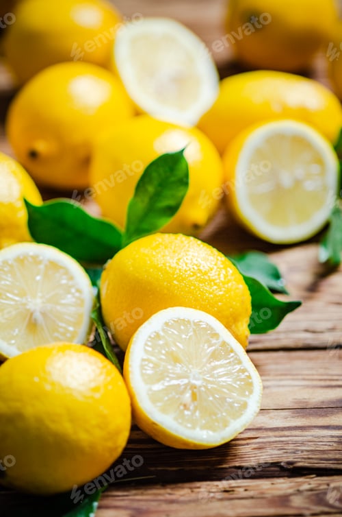 Preview: Fresh lemons. On wooden table.