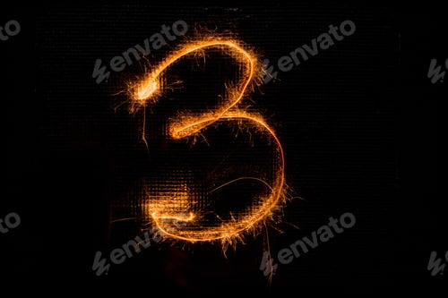 Preview: The Number 3 Made Of Sparklers On Black Background