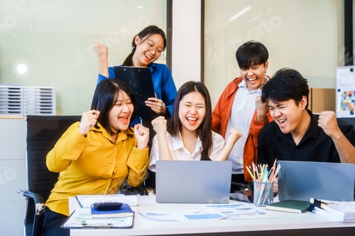 Preview: Five young Asian professionals collaborate at a startup meeting, analyzing finances, strategy