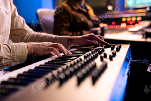 Preview: Musician Playing Synthesizer Keyboard in Recording Studio