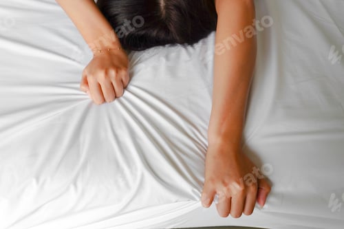 Preview: A photo of a man and woman's hands having sex on a bed. make love.