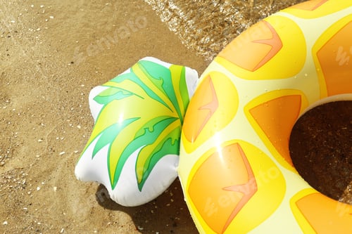 Preview: Bright inflatable pineapple ring near sea on sunny day, closeup. Space for text