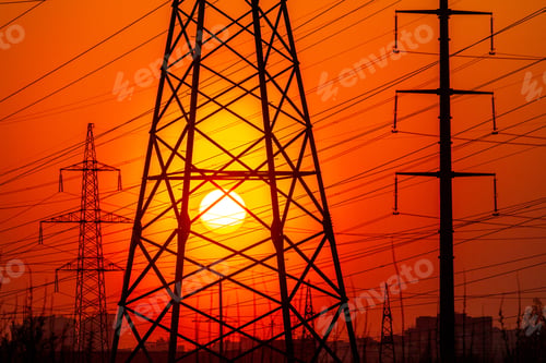 Preview: Closeup shot of high voltage electricity transmission towers at sunset
