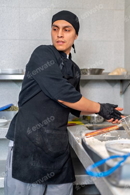 Preview: Peruvian chef preparing fish in restaurant kitchen