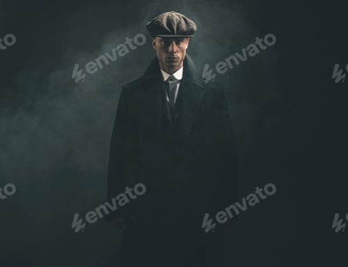 Preview: Threatening Retro 1920S English Gangster In Smoky Room.