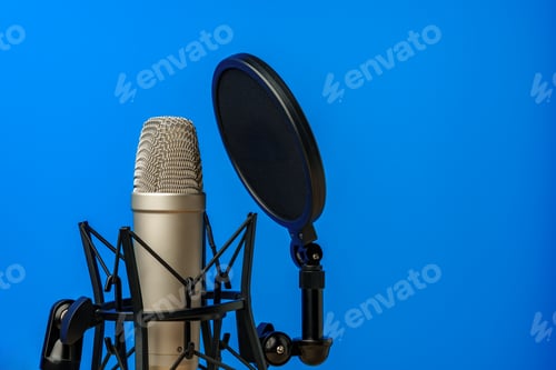 Preview: Professional microphone stand over blue studio background