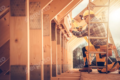 Preview: Construction Worker Using a Power Drill on a Wooden Frame in a Partially Built Structure