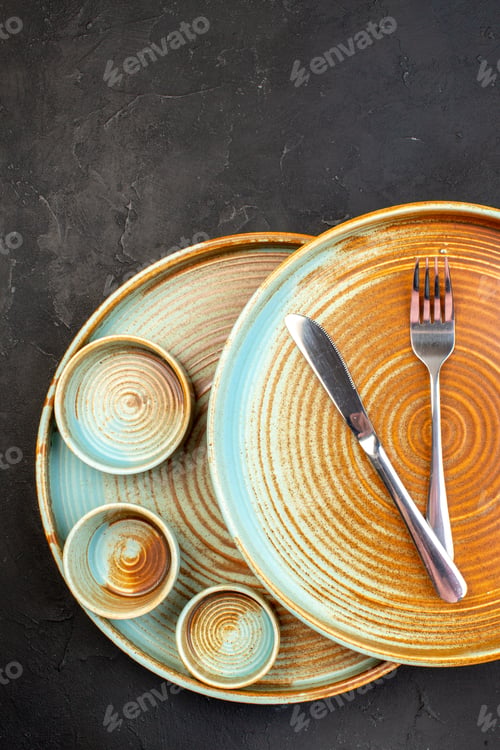 Preview: top view brown plates with little plates on dark background food color table kitchen cutlery ceramic