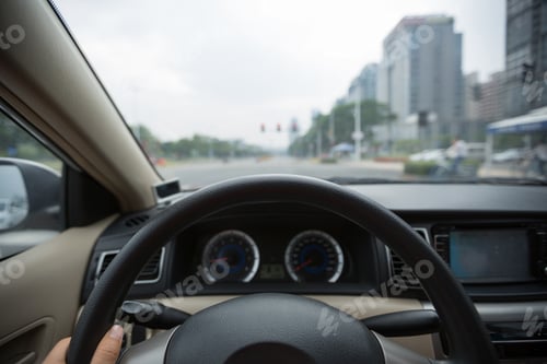 Preview: Driving car waiting the traffic light on street
