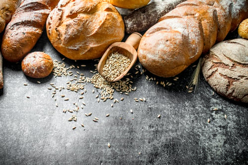 Preview: The range of types of fresh bread with grain.