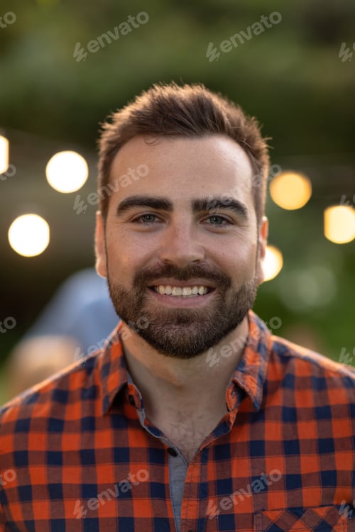 Preview: Caucasian man smiling and looking at camera