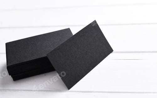 Preview: Black Business Cards Stacked on White Background