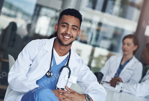 Preview: Being a doctor is my calling. Shot of a young male doctor taking a break from his rounds.