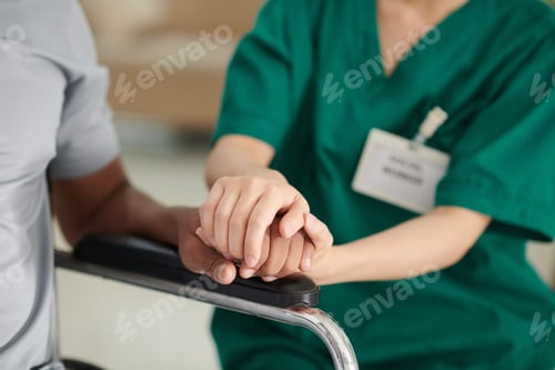 Preview: Caregiver Touching Hand of Patient