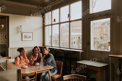 Preview: Friends hanging out at cafe