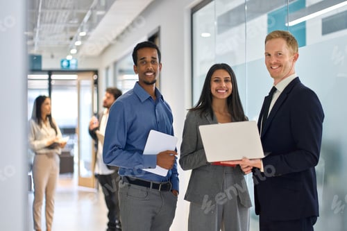 Preview: Professional diverse team young business people standing in office. Portrait