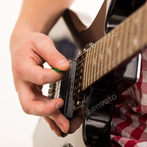 Preview: Music, close-up. Young musician holding electro guitar