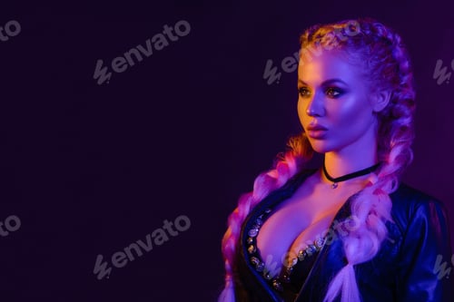 Preview: Portrait of seductive young European woman surrounded by evening neon lights medium close-up