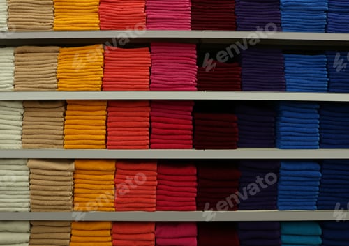 Preview: Stacks of colourful towels on store shelves